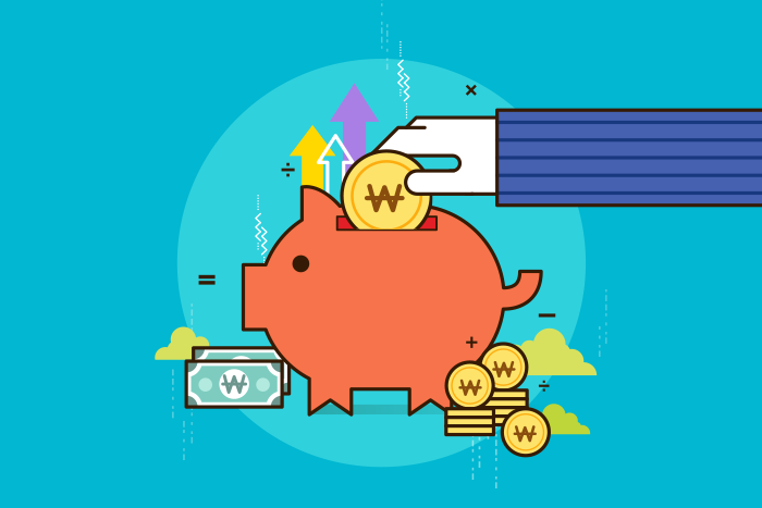 A hand adding Korean won coins to a piggy bank, illustrating regular saving for future financial goals